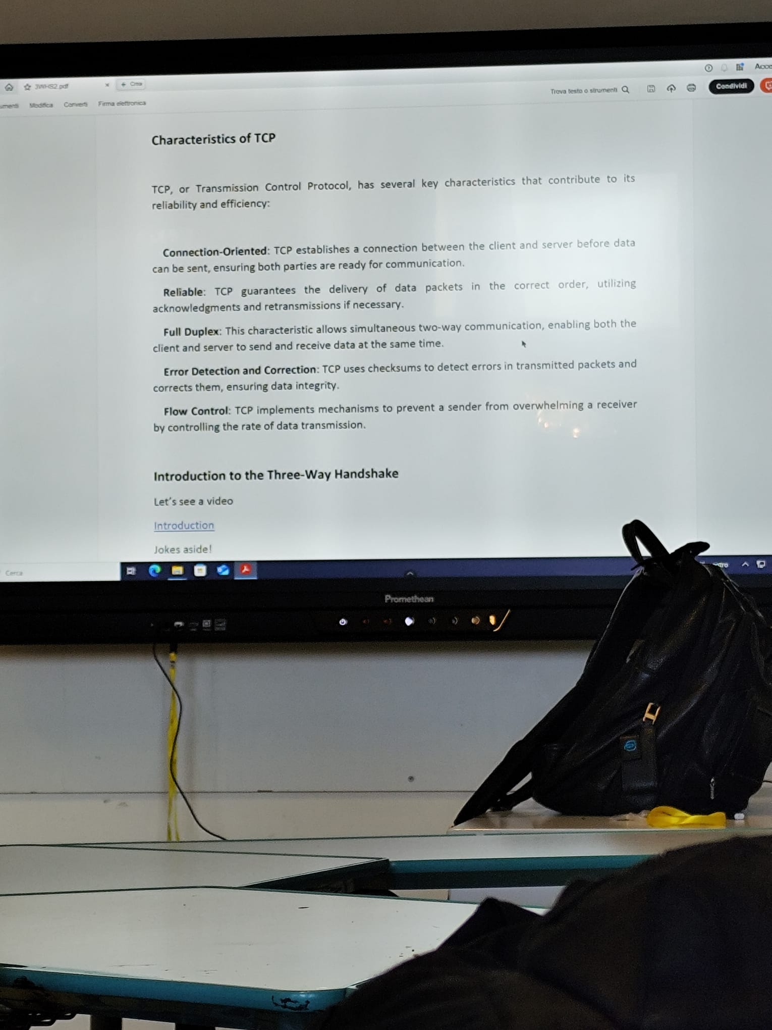 A checked technical text projected during a project classroom lesson.