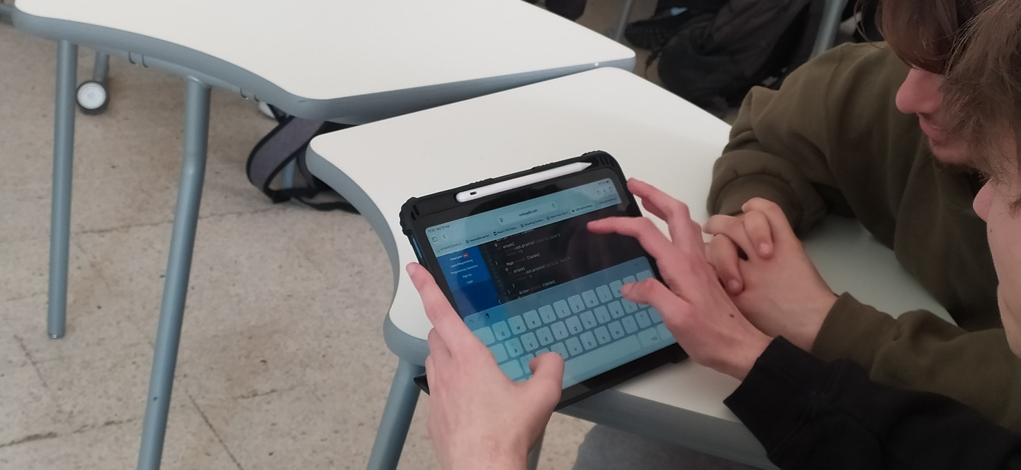 Students collaborating on a UML and Java aggregation project.